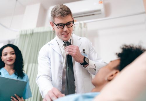 outpatient-doctor-with-patient-and-nurse