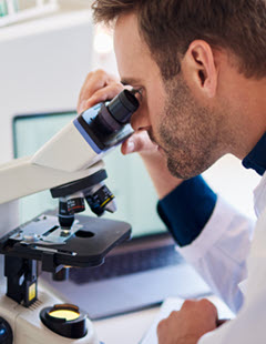 pathologist-at-microscope