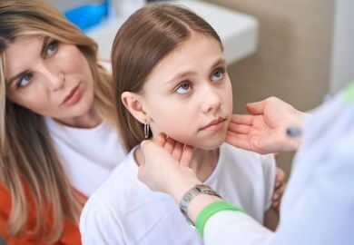 pediatric-doctor-checking-lymph-nodes-of-girl