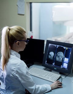 radiology-specialist-looking-at scans