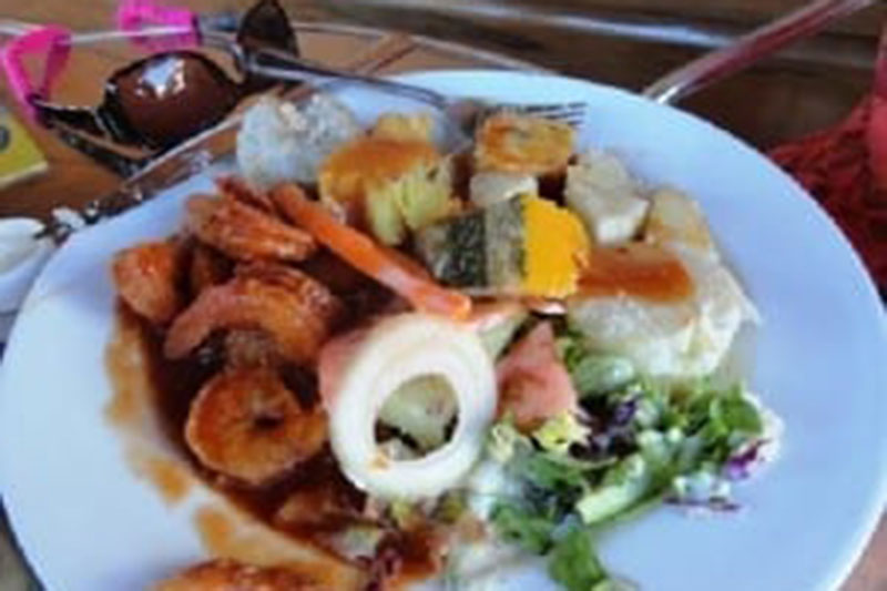 Shrimp creole with yam at El Fredo's. Photo: TripAdvisor.com