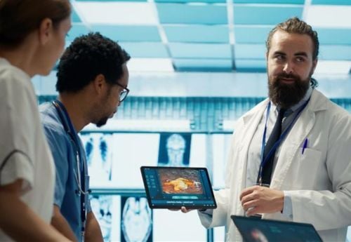 three-doctors-looking-at-scans