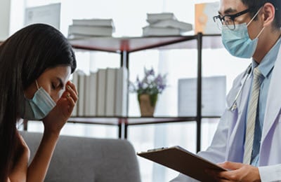 woman with brain fog at doctor