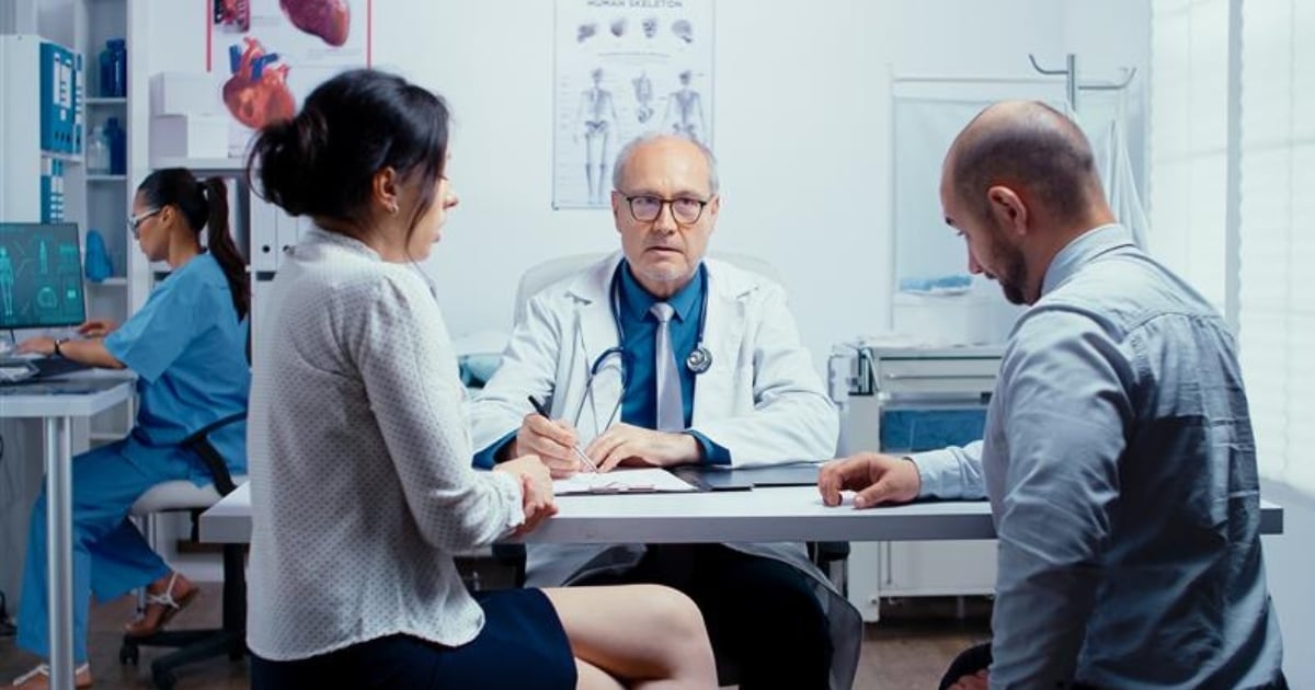 middle aged doctor with patients