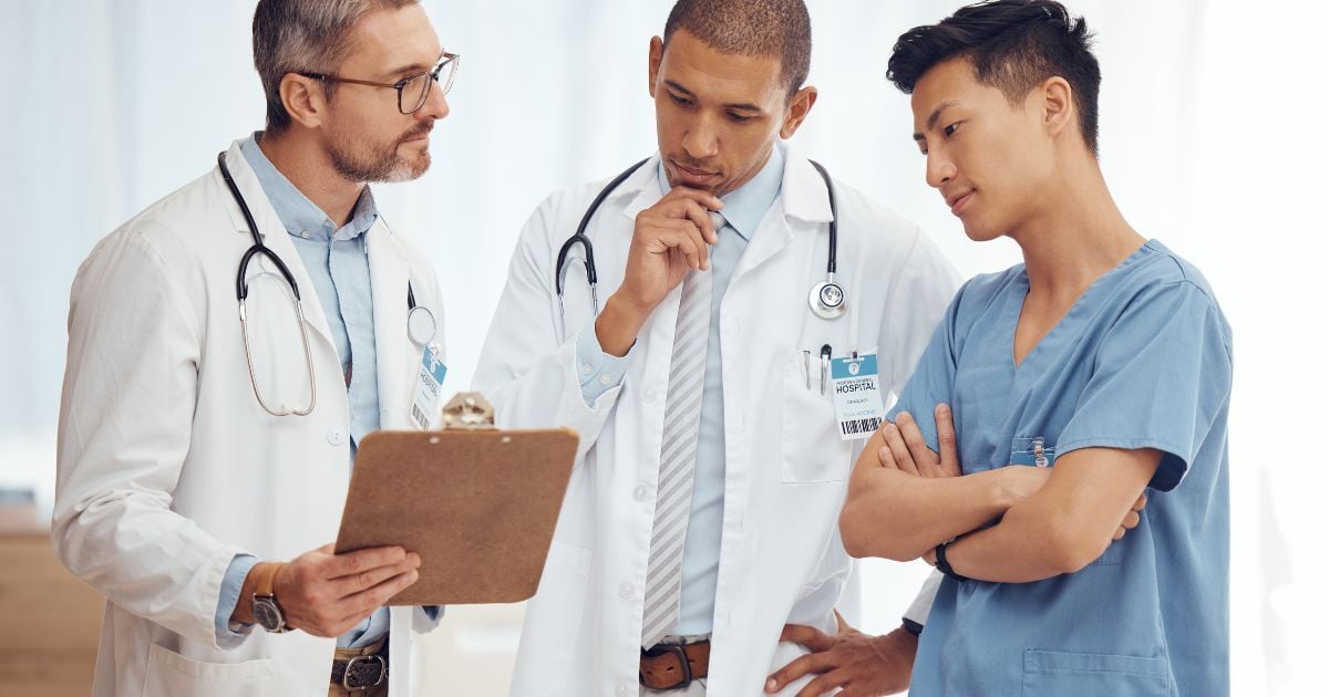 Primary care physician with two other physician specialists